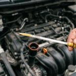 Checking engine oil level with the dipstick